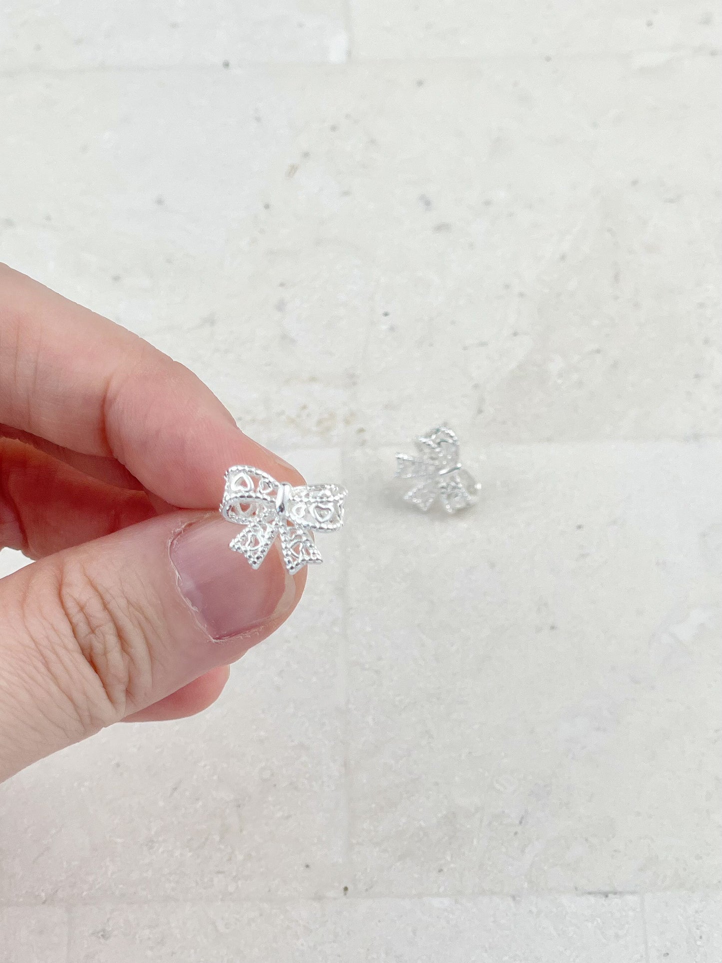 Silver Plated Hollow Lace Bow Stud Earrings