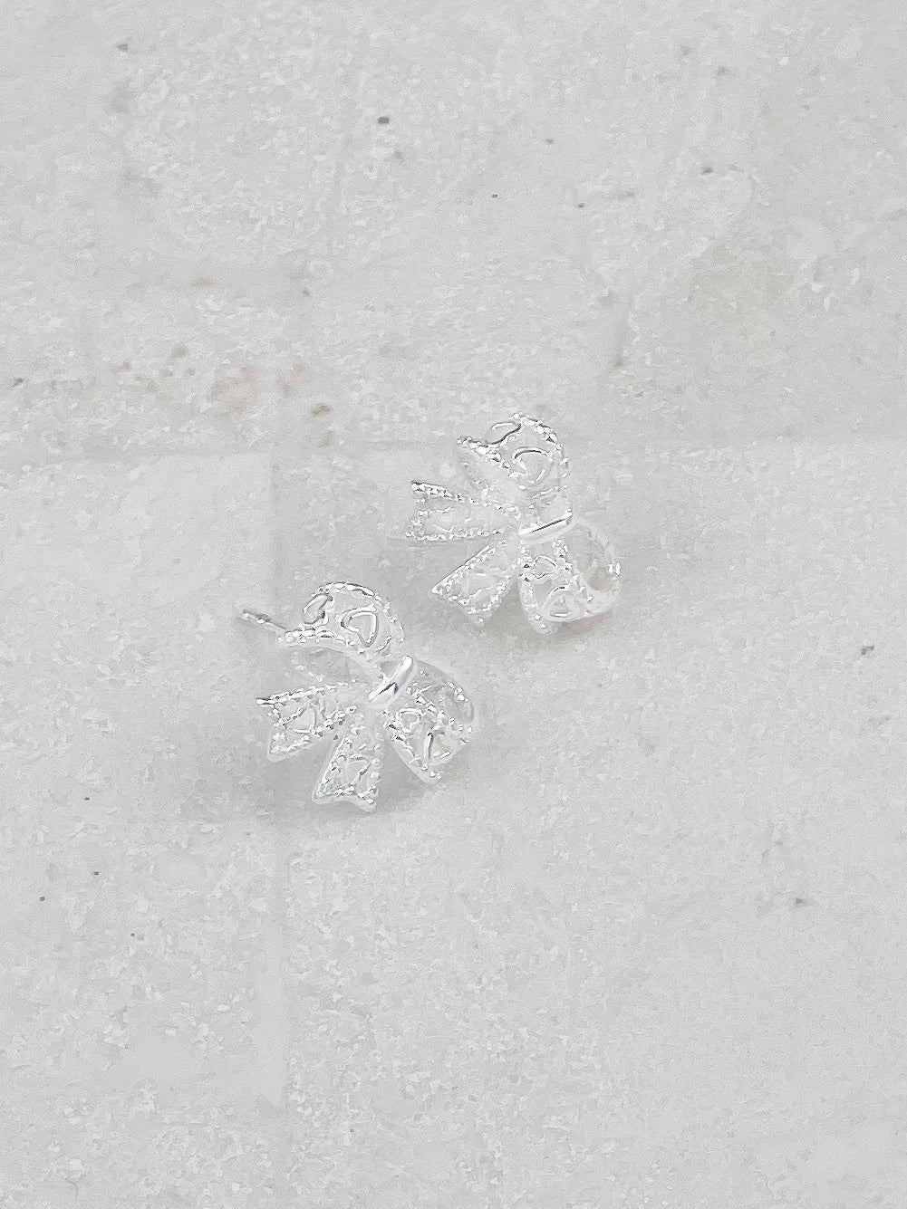 Silver Plated Hollow Lace Bow Stud Earrings